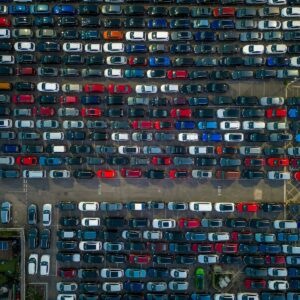 A parking lot filled with lots of parked cars